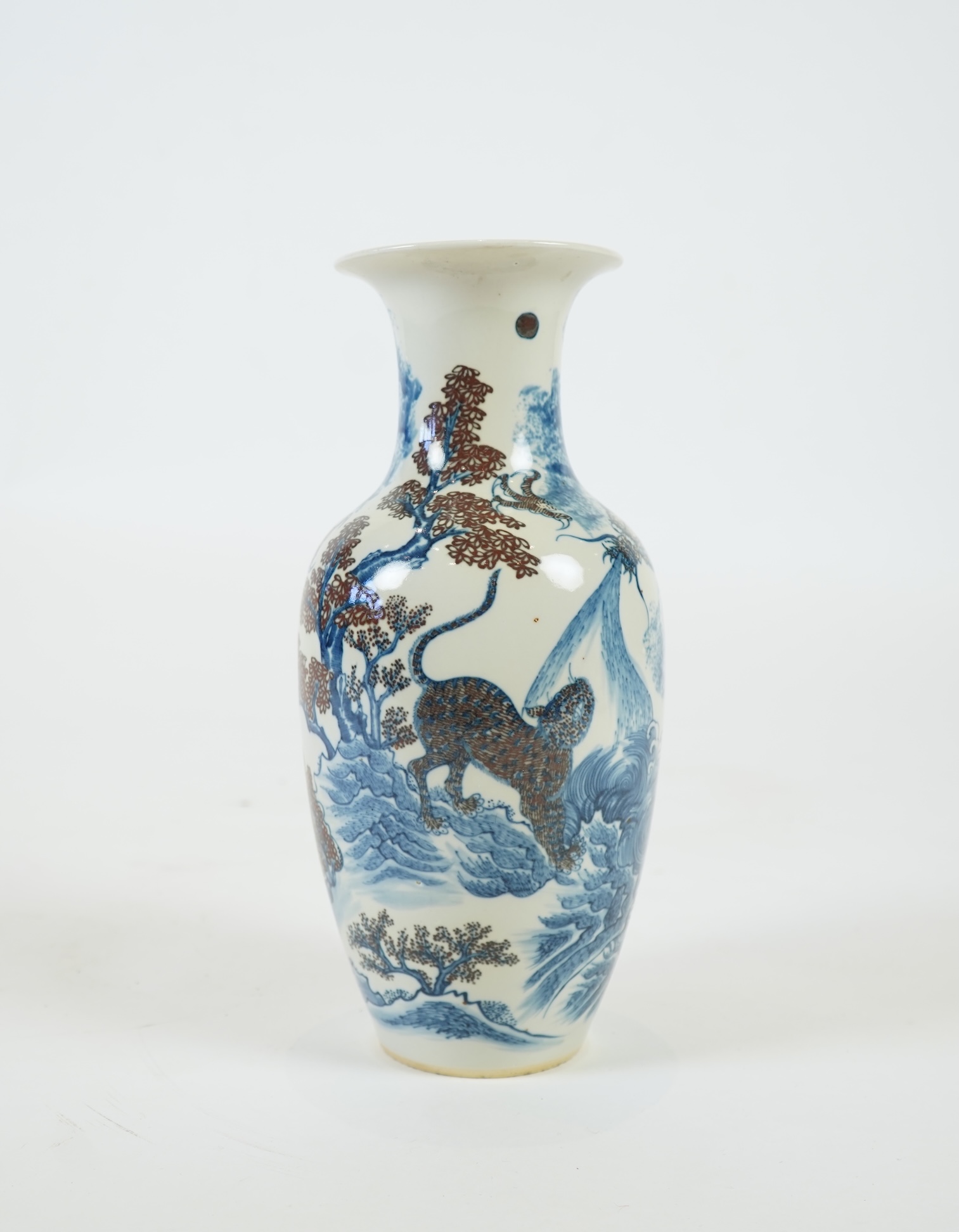A Chinese underglaze blue and copper red ’dragon and tiger’ baluster vase, possibly 19th century